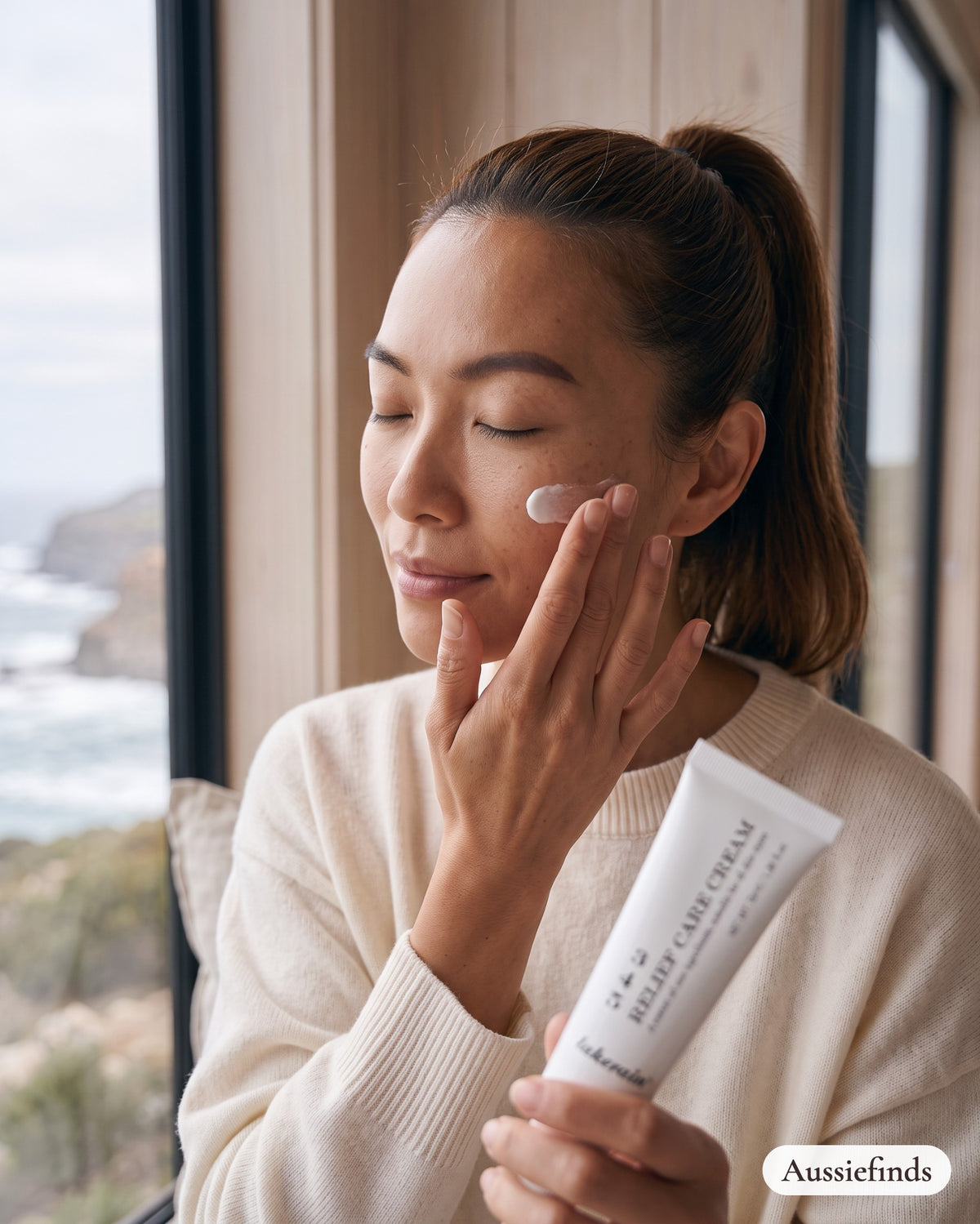 Model smoothing the 3 4 5 Relief Care Cream onto her cheek