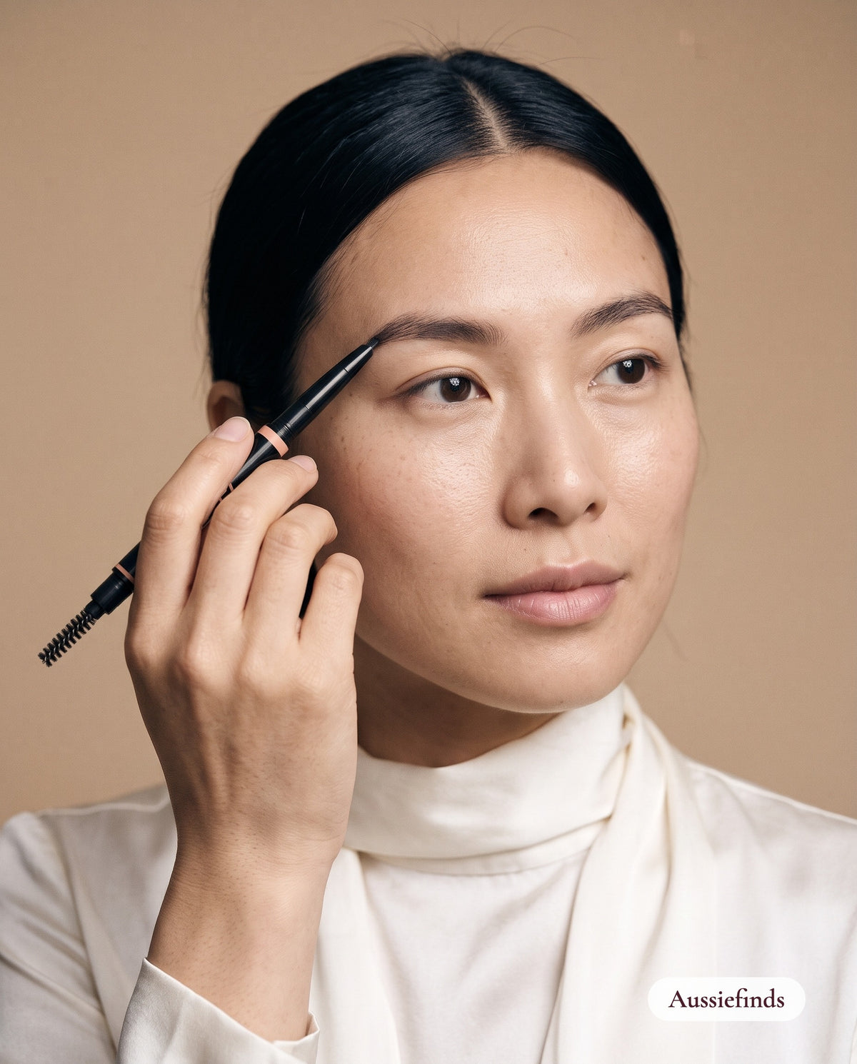 Close-up of a model filling in her brows with the 2-in-1 Brow Pencil