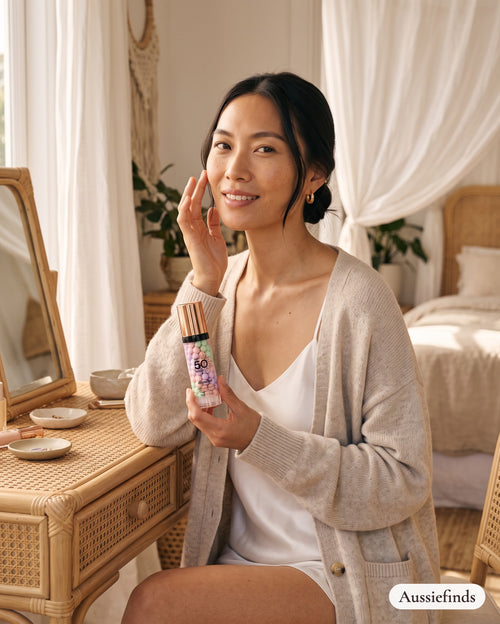 Model holding the 3-Colour Colour-Correcting Primer in a Byron Bay beach house