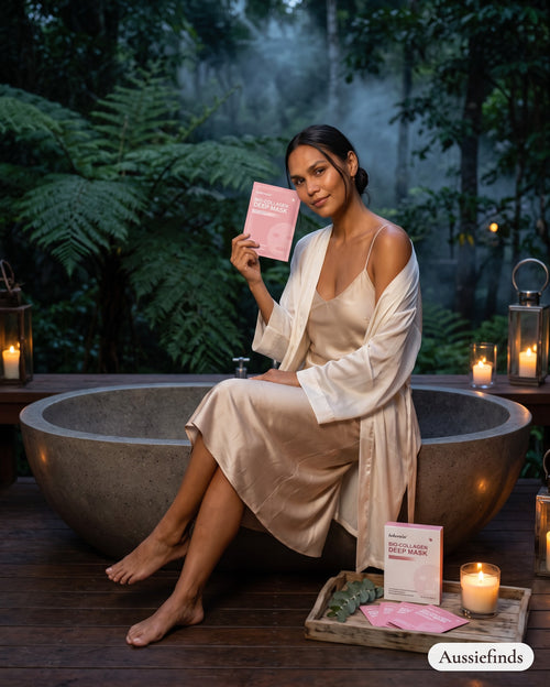 Model holding the Bio-Collagen Deep Mask sachet in a Daintree Rainforest treehouse at dusk
