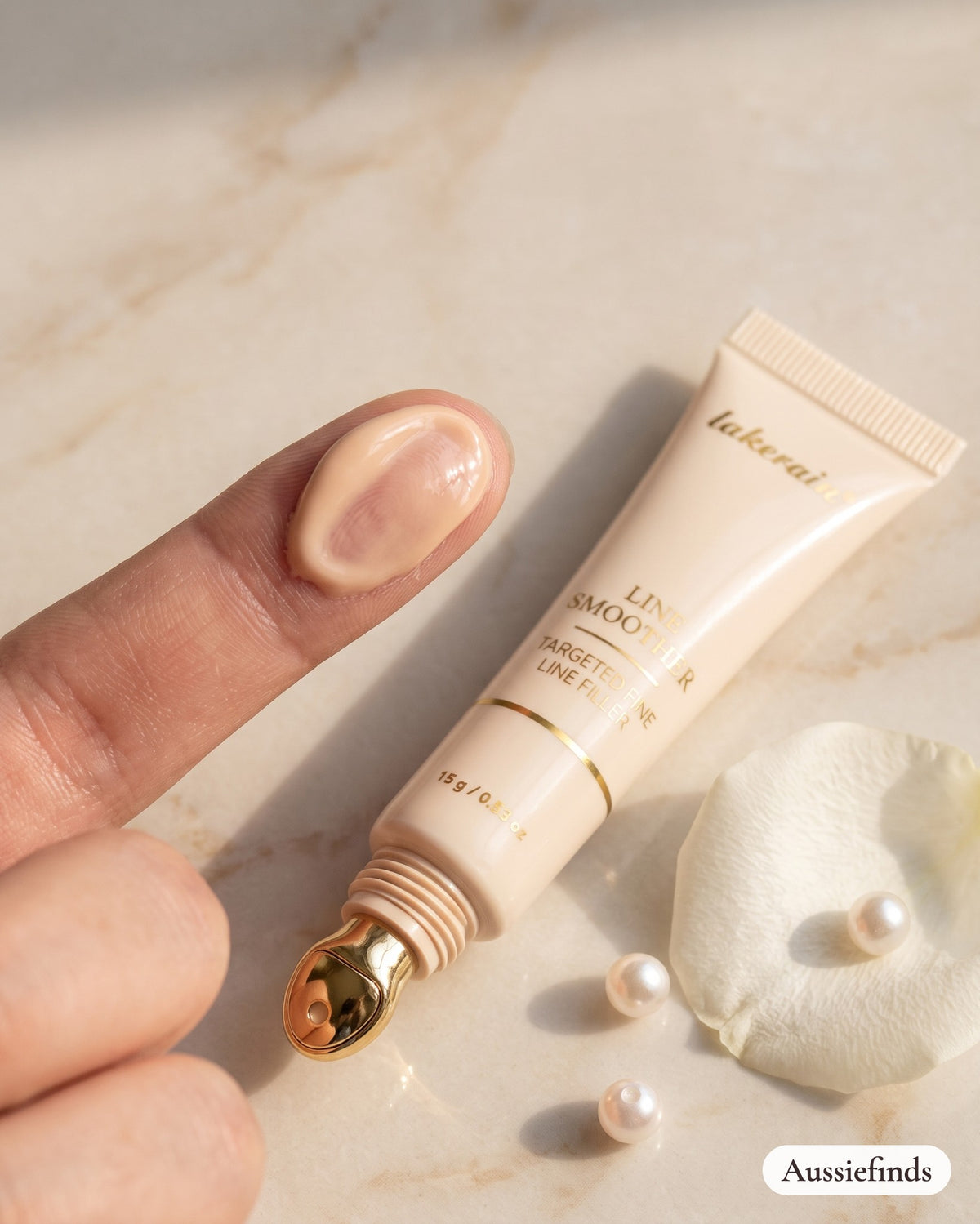 Line Smoother silky primer texture on a fingertip