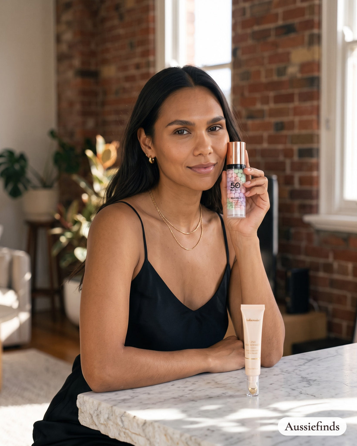Model holding the 3-Colour Primer from the Flawless Base Duo in Melbourne