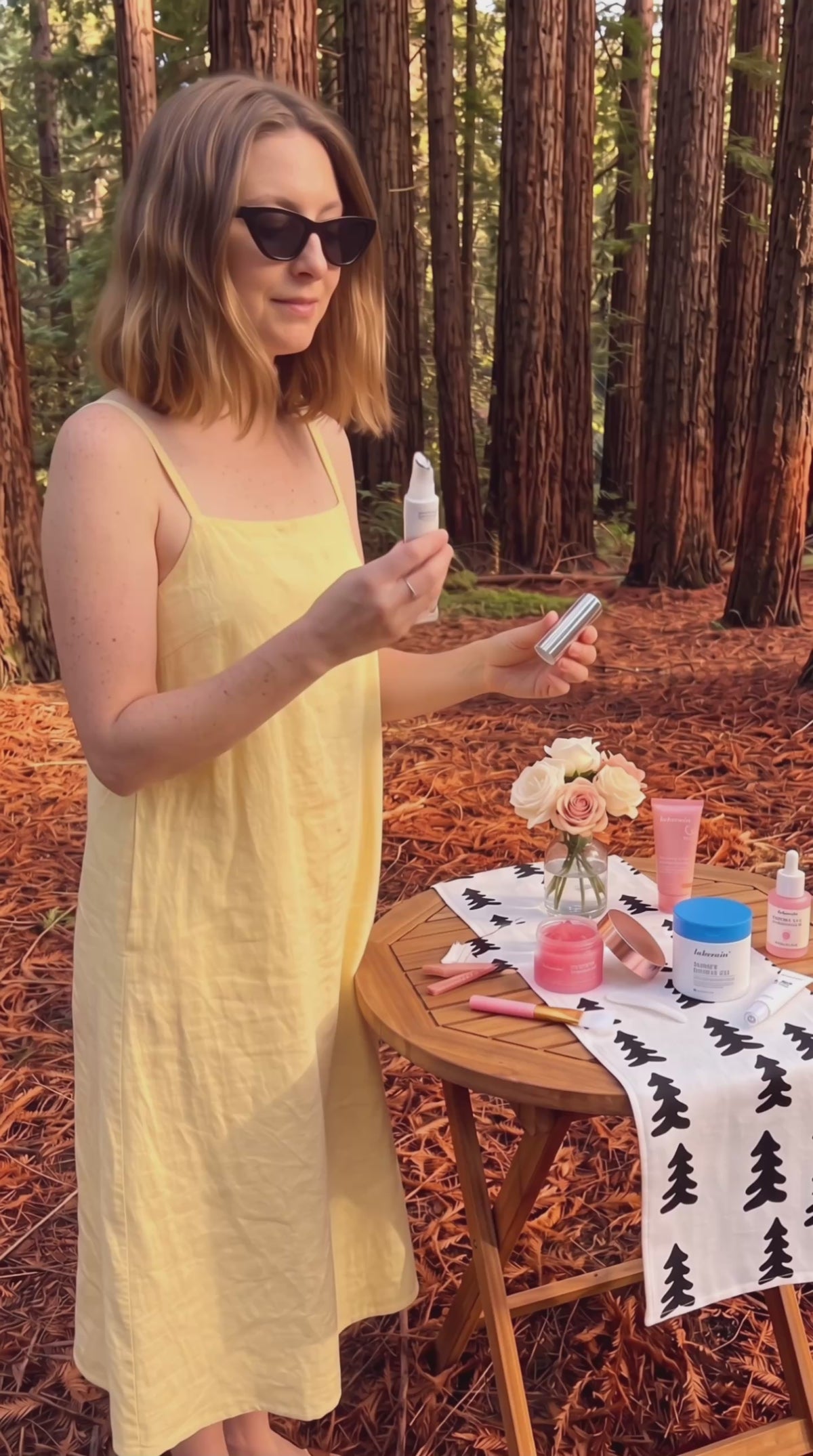 Model applying the Glow Lip Volumizer for glossy, fuller-looking lips